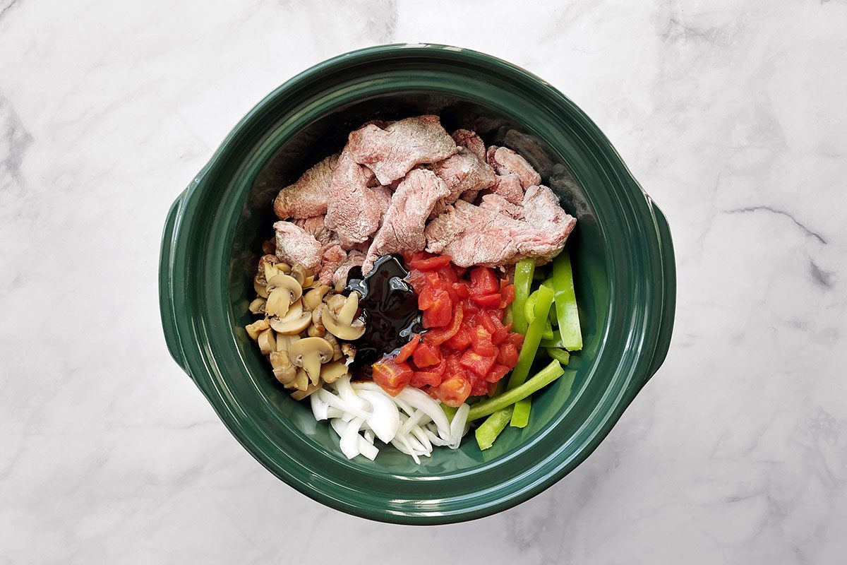 How to make Taste of Home's Round Steak recipe, step two with ingredients in a slow cooker