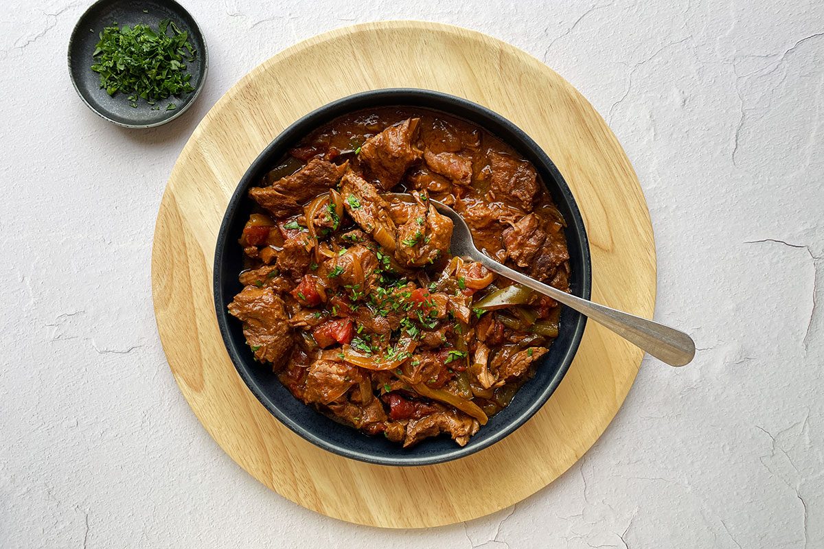 Taste of Home's Round Steak recipe in a black bowl