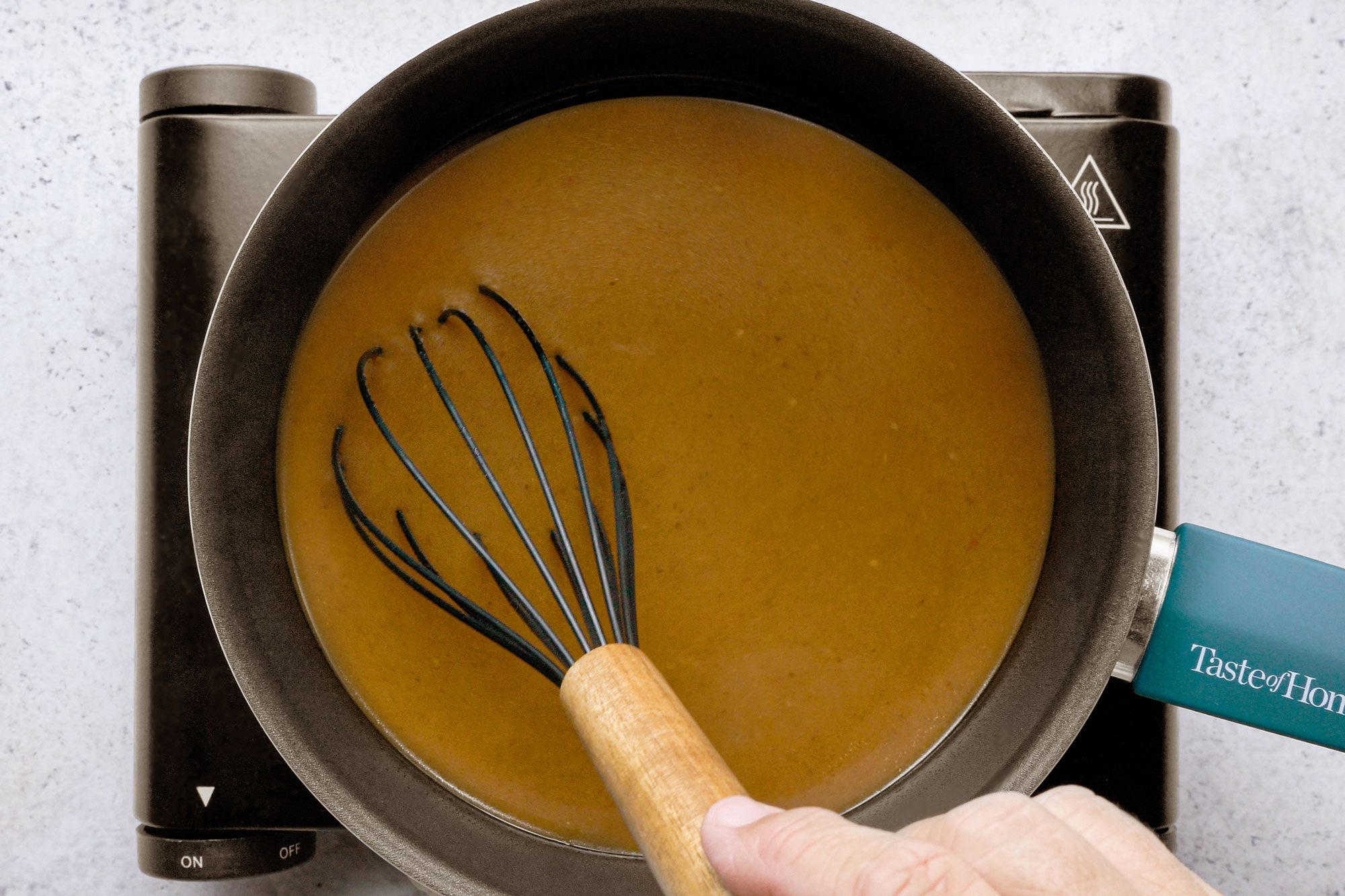 overhead shot of cooking juice in a pan