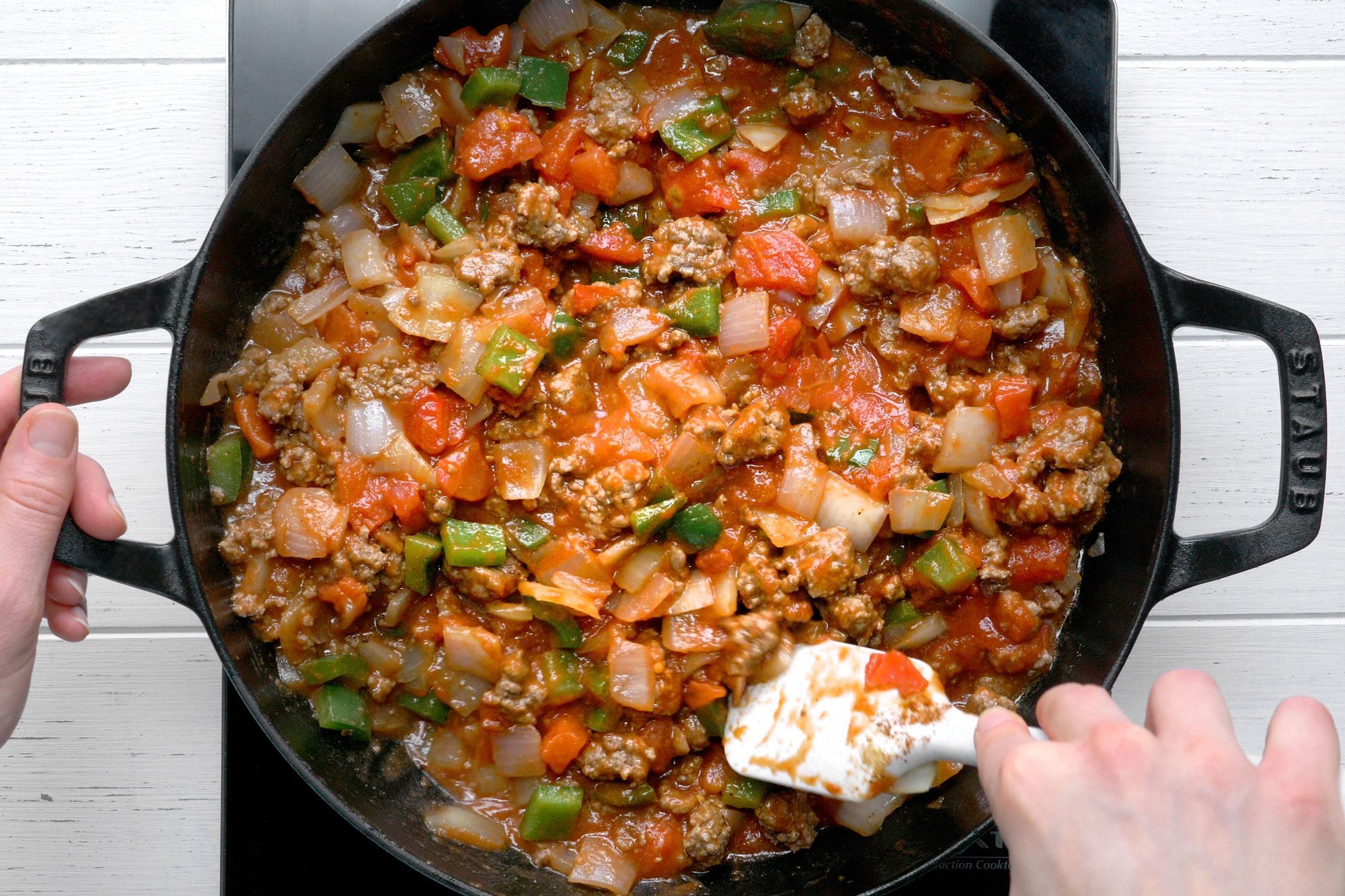 Stir in the tomato sauce, canned tomatoes and seasonings