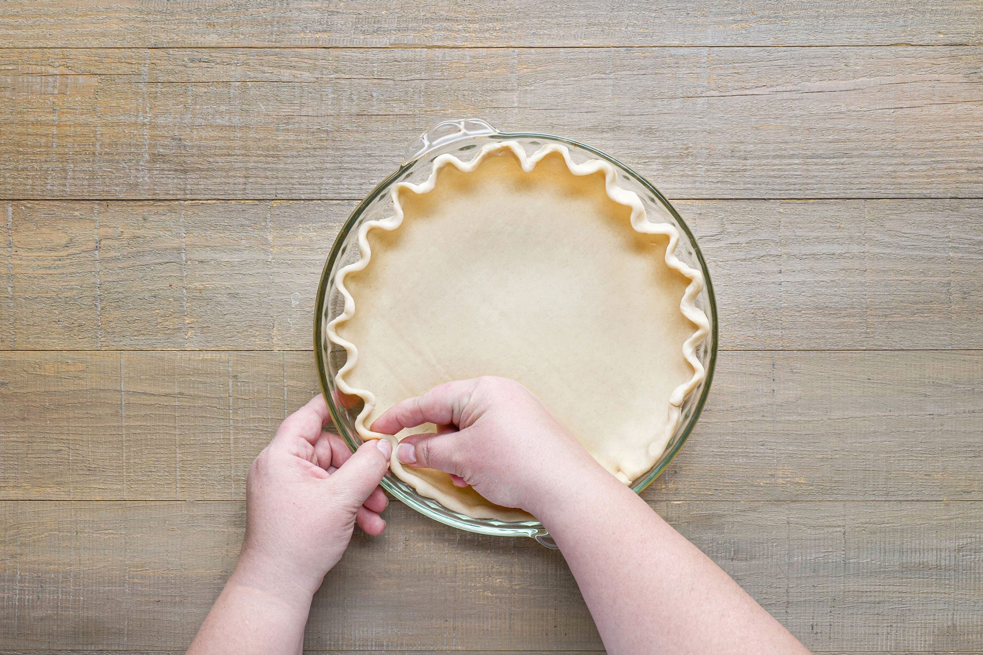 Trim and flute the edges of pastry