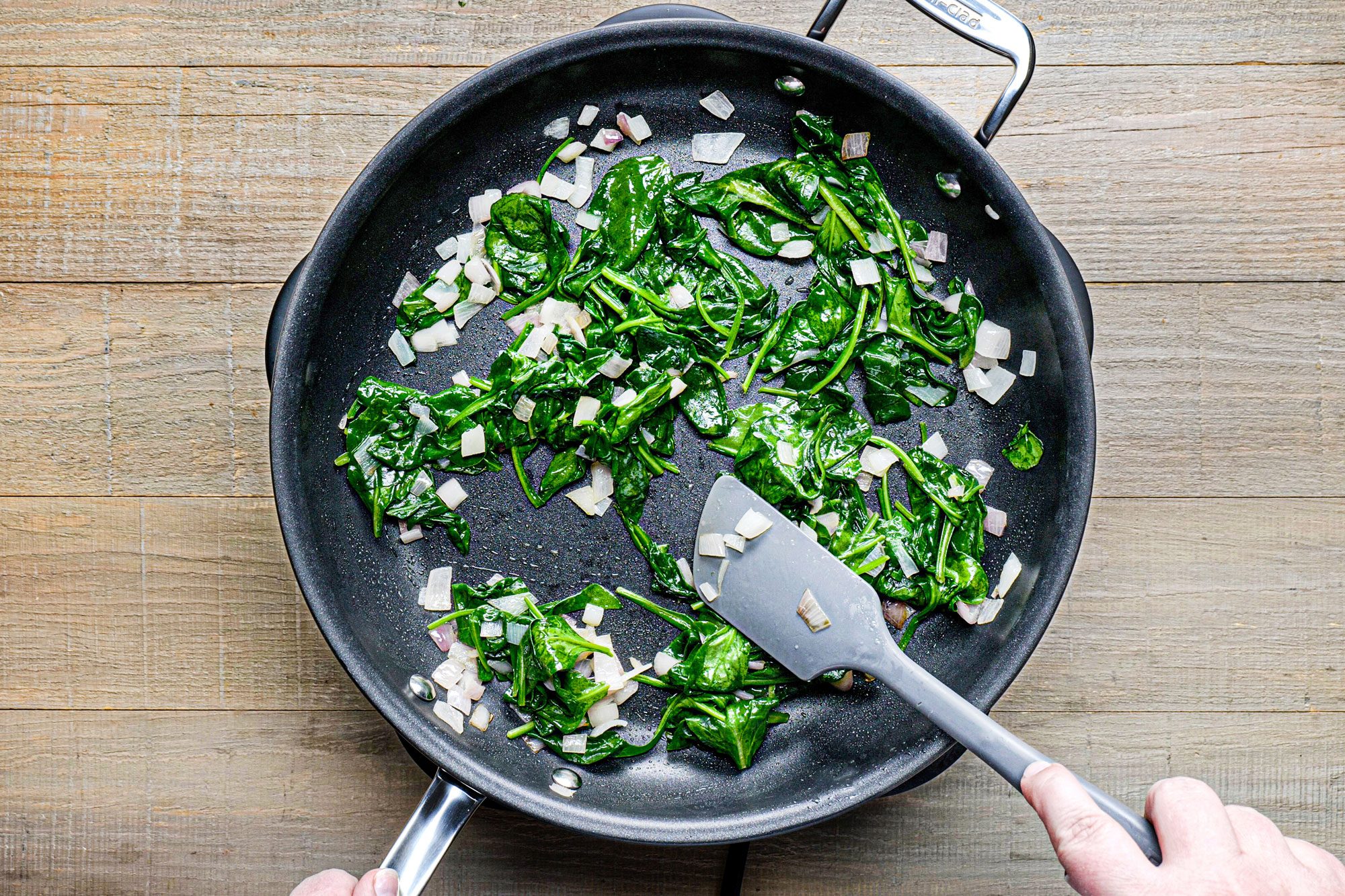 Stir in the spinach and cook until wilted in a large skillet