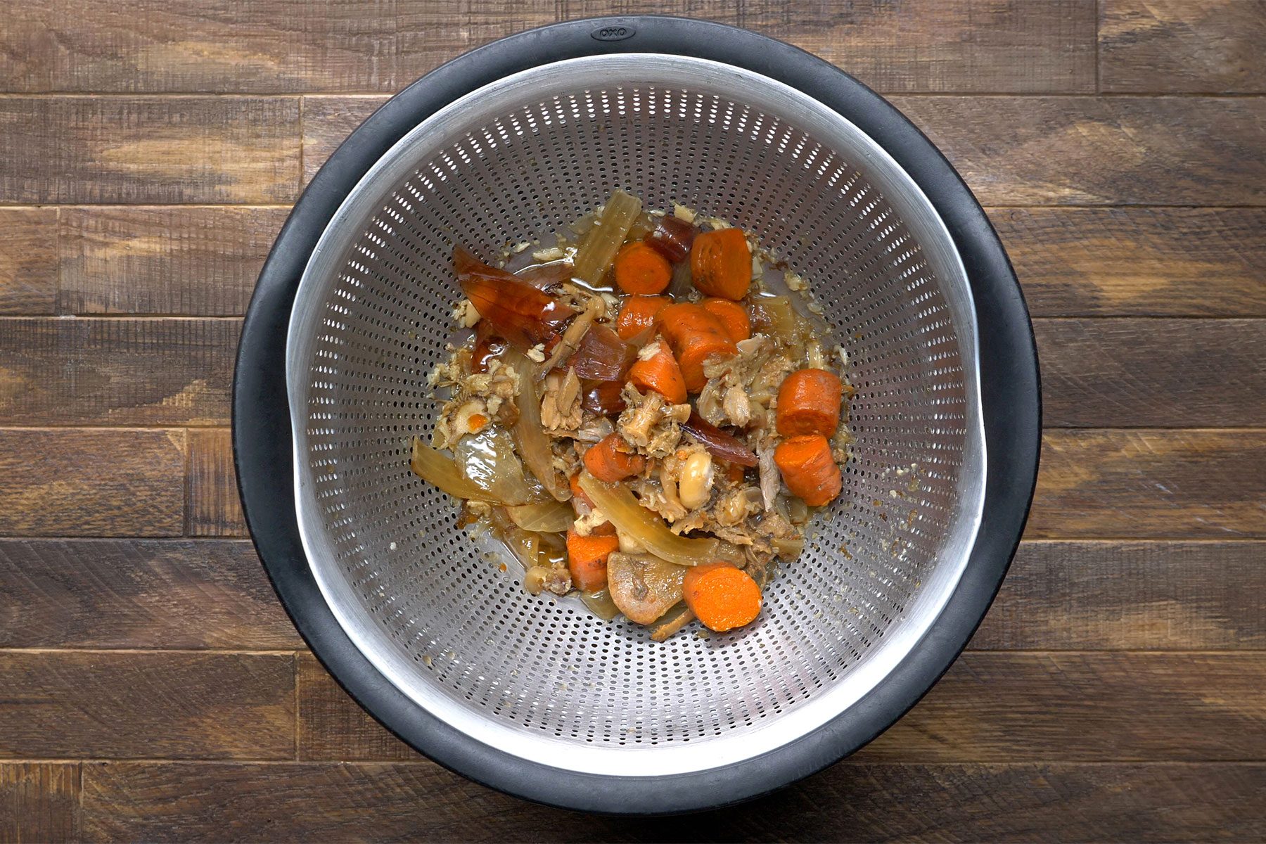 overhead shot of strained bones and vegetables