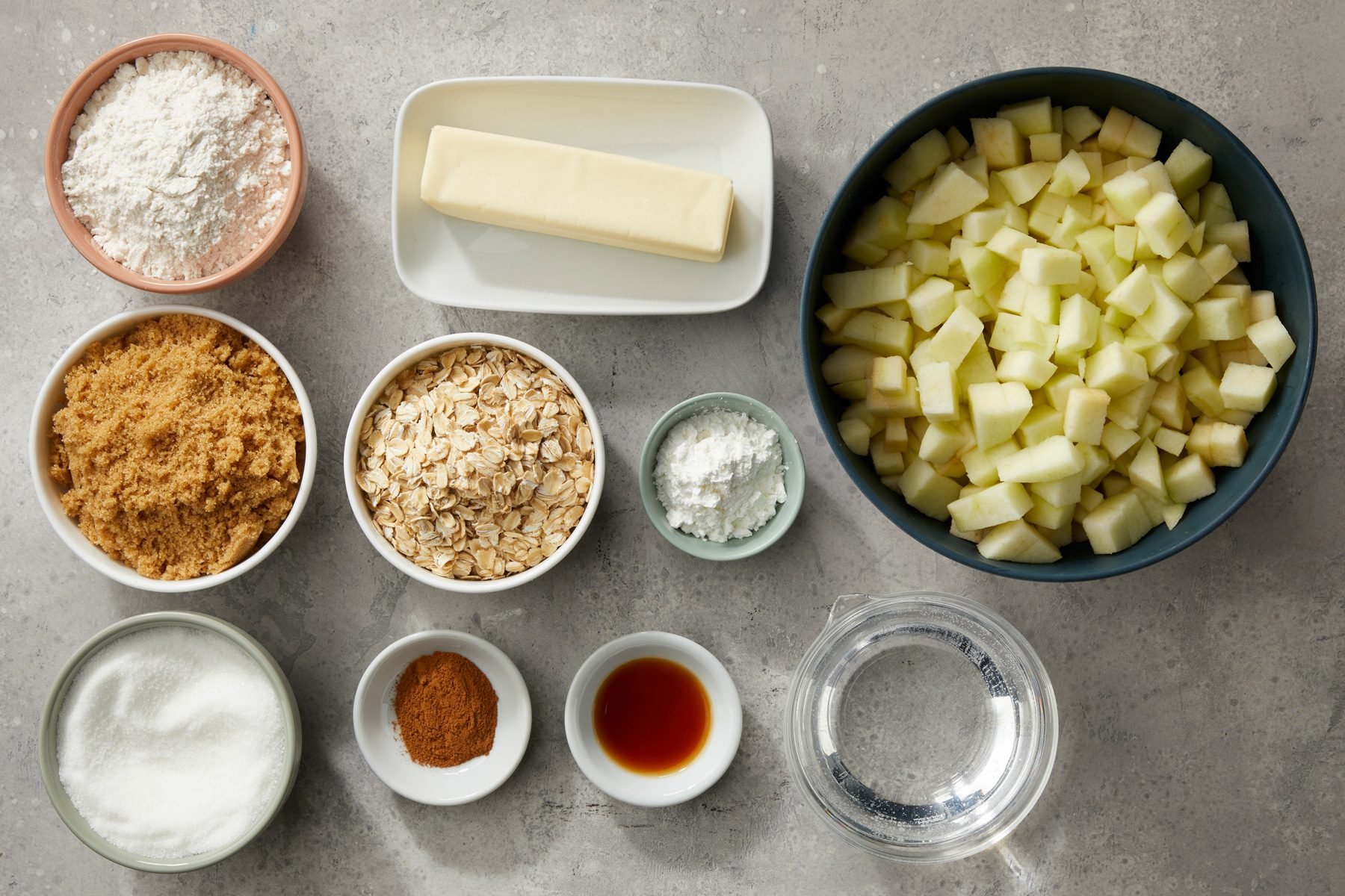 Ingredients of Apple Crisp arranged on a table