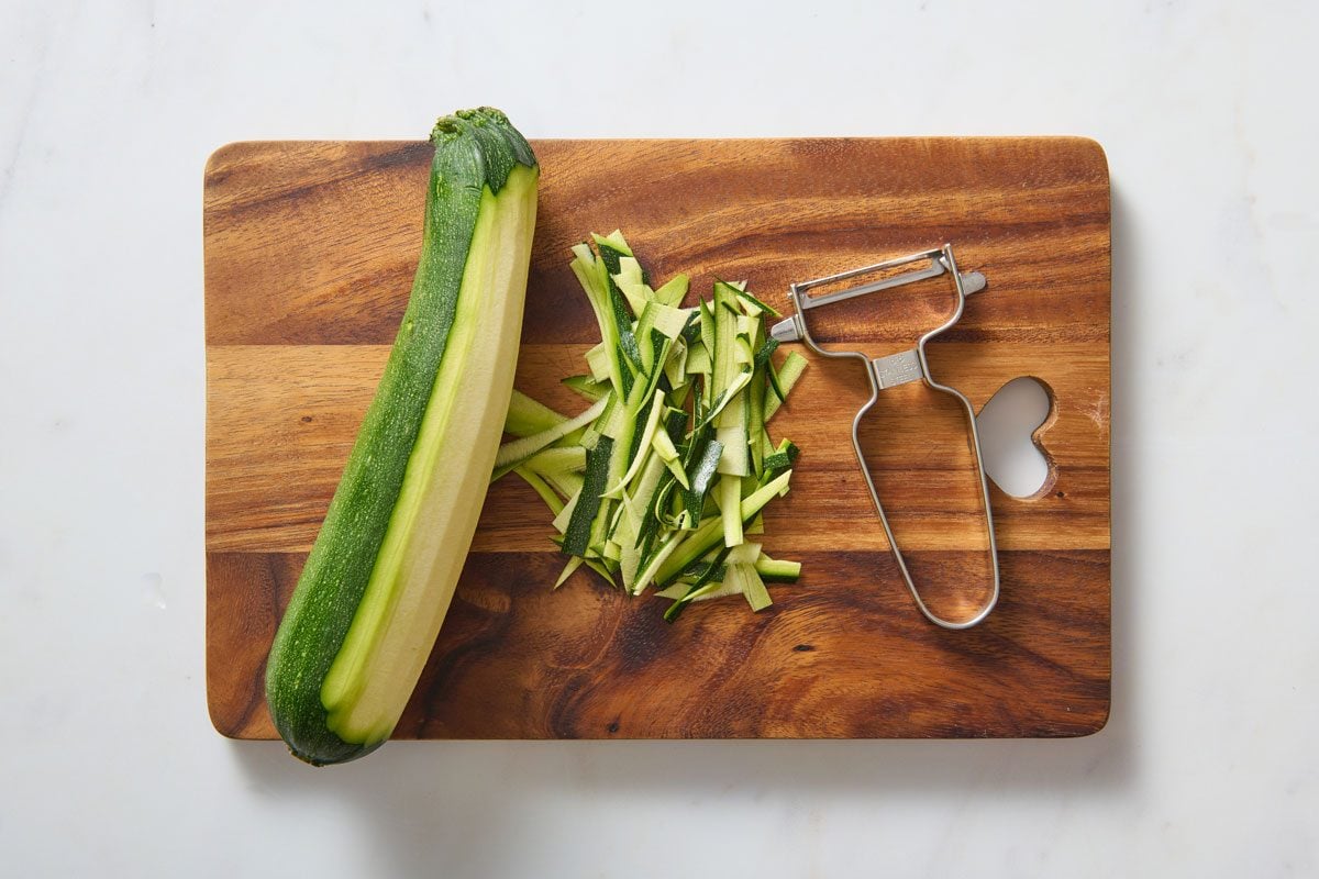 Peeled Zucchini On A Chopping Board