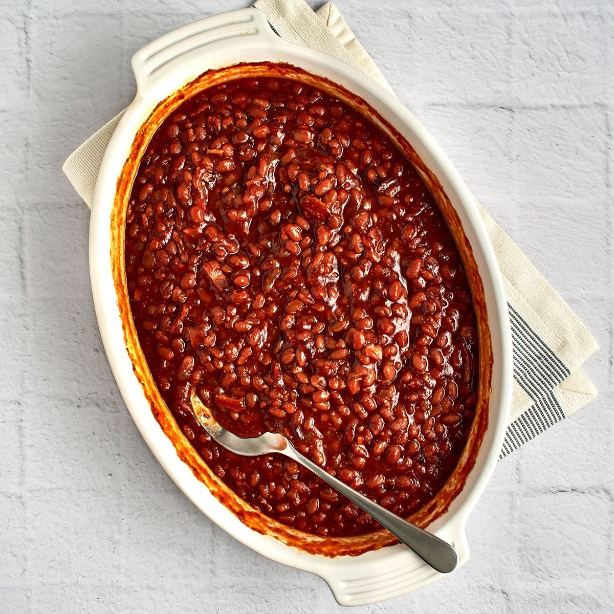 These baked beans with bacon by Taste of Home will round out any meal, but they're particularly good served alongside cornbread.