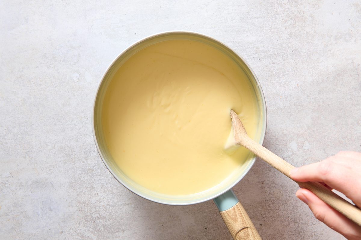 Stirring butter and vanilla into pudding mixture