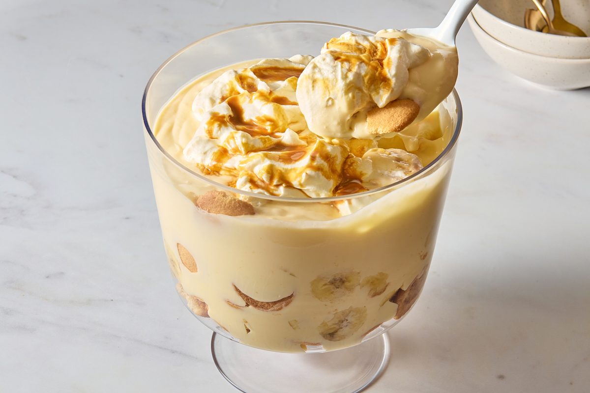 Closeup of banana pudding cup being scooped out with a large spoon