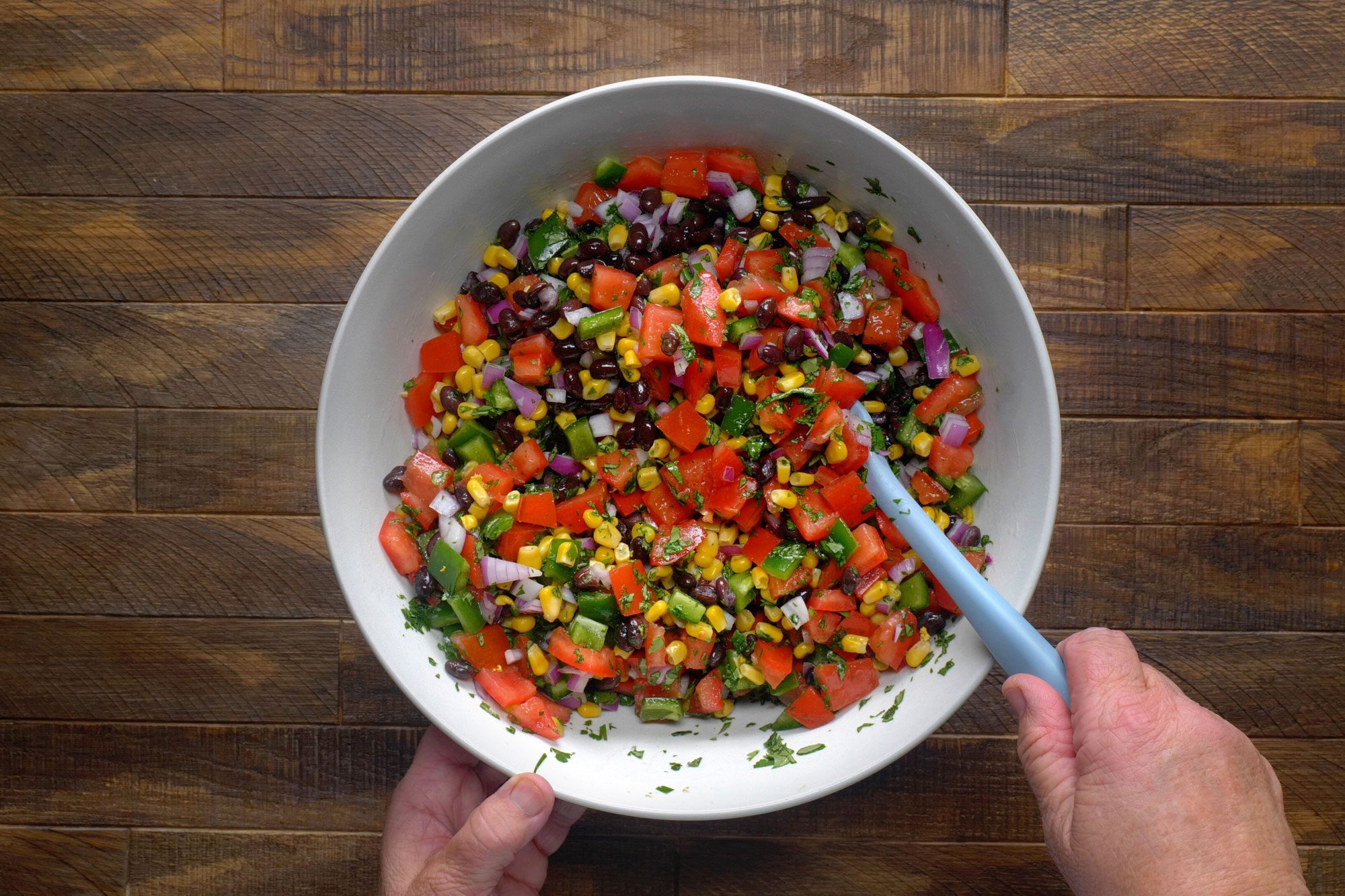 Combine the beans, corn, tomato, onion, cilantro, lime juice, salt and jalapeno in a large bowl