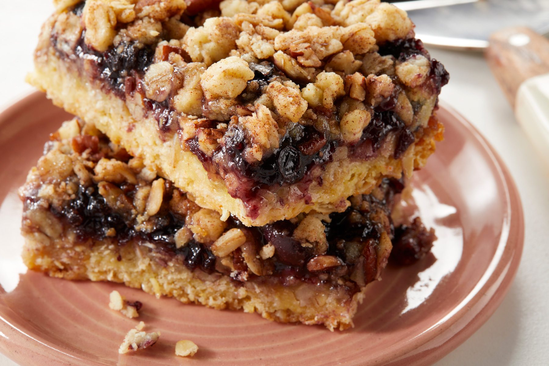 Close up Blueberry Crumble Bars in a plate