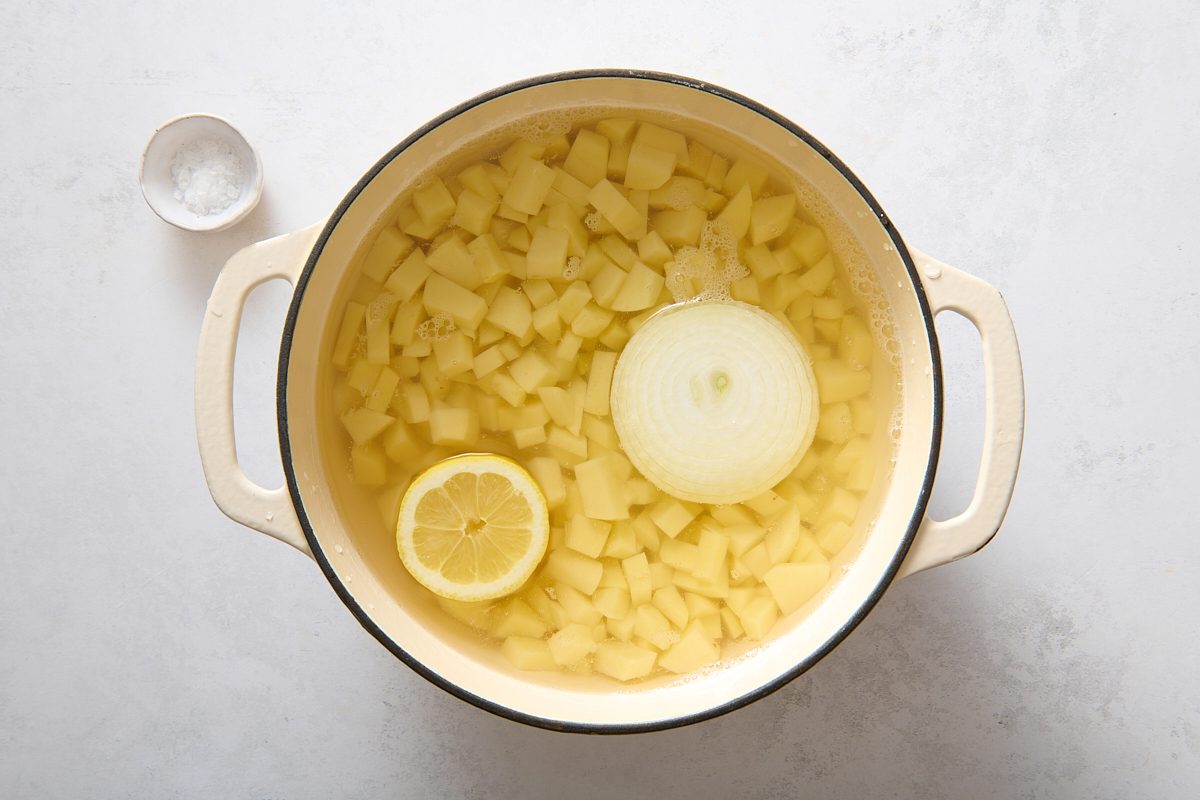 Cooking the potatoes with onion and lemon