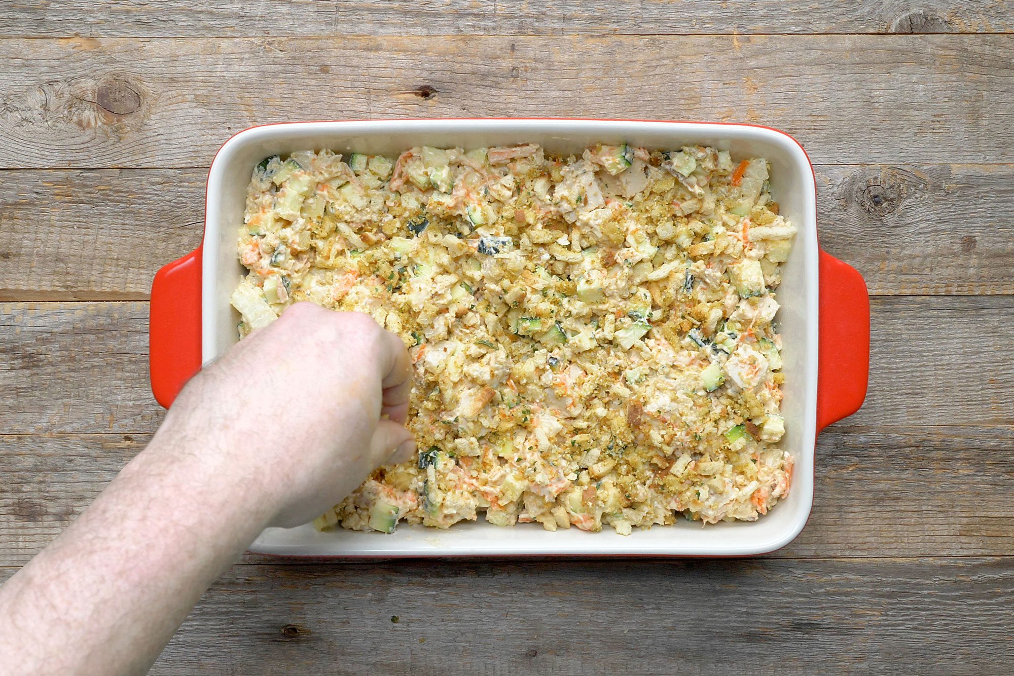 overhead shot of stuffing mix spreaded over dish