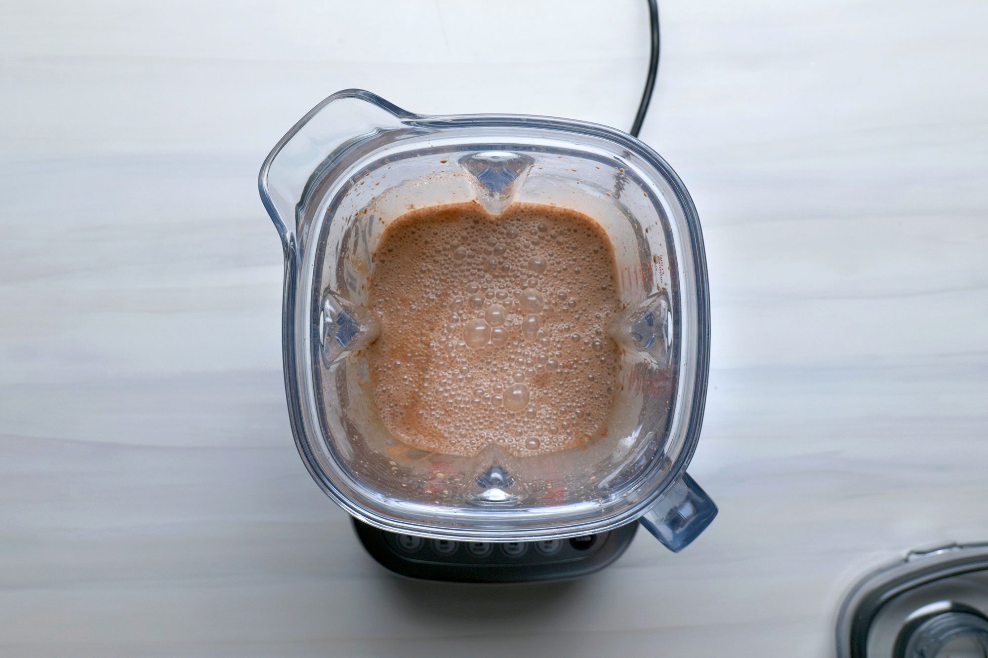 Combine sugar, cocoa and vanilla in a blender
