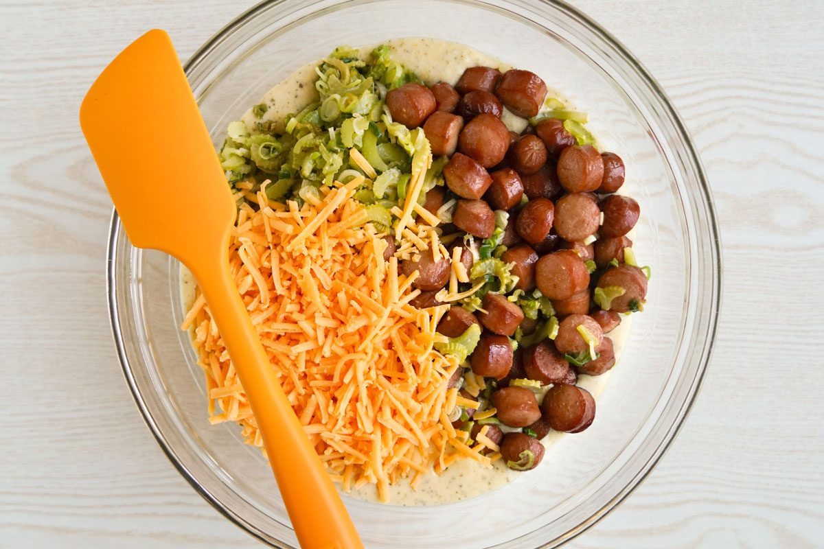 Mixing All The Vegetables And Hotdogs In A Bowl