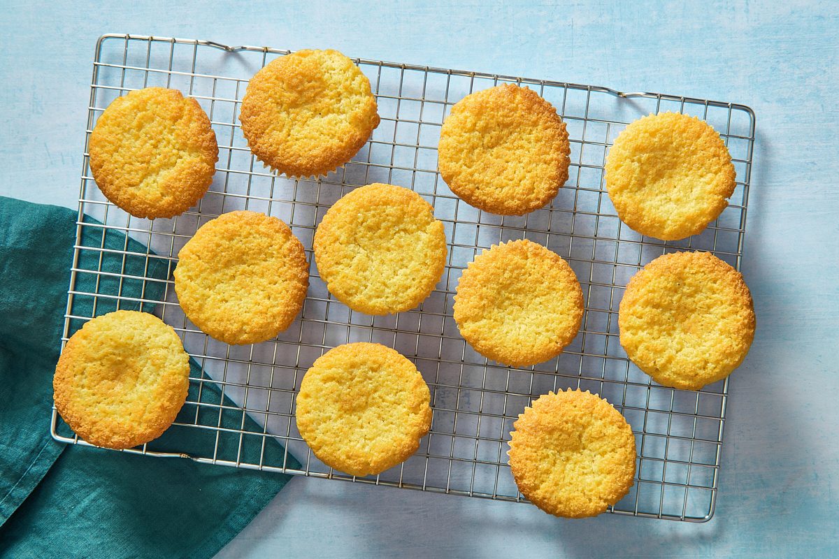 Overhead shot of cornbread muffins on a cooling rack