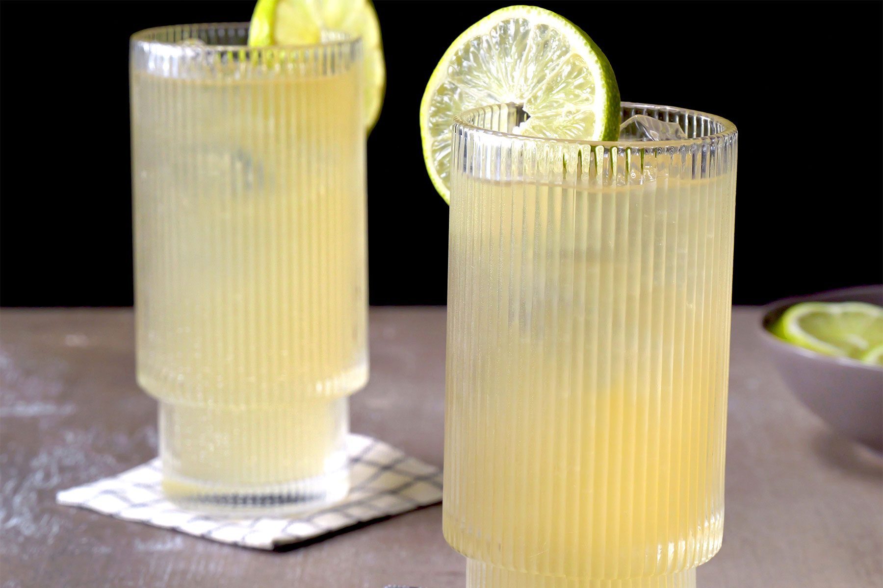 horizontal shot; Dark n' Stormy in two glasses with two lemon slices