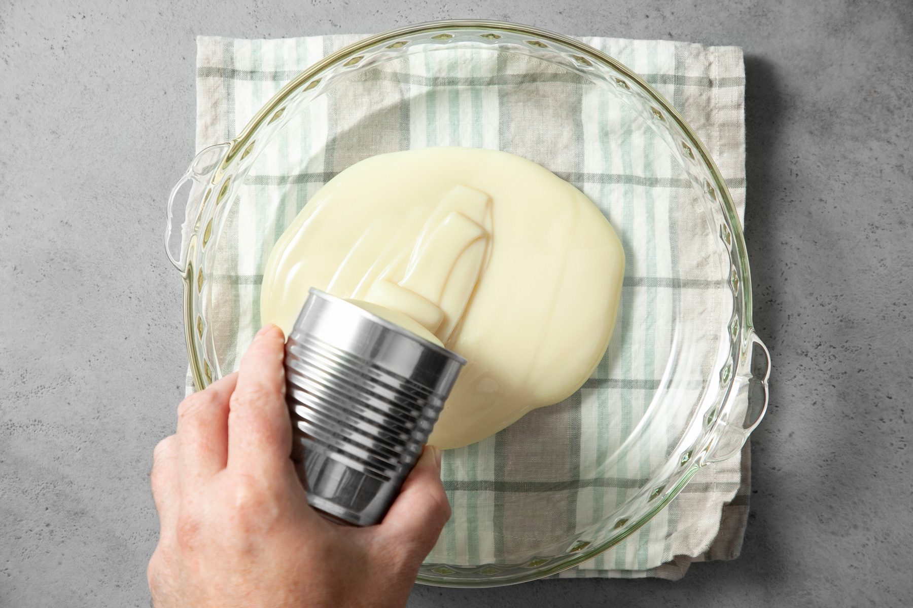 Pour the sweetened condensed milk into a pie plate