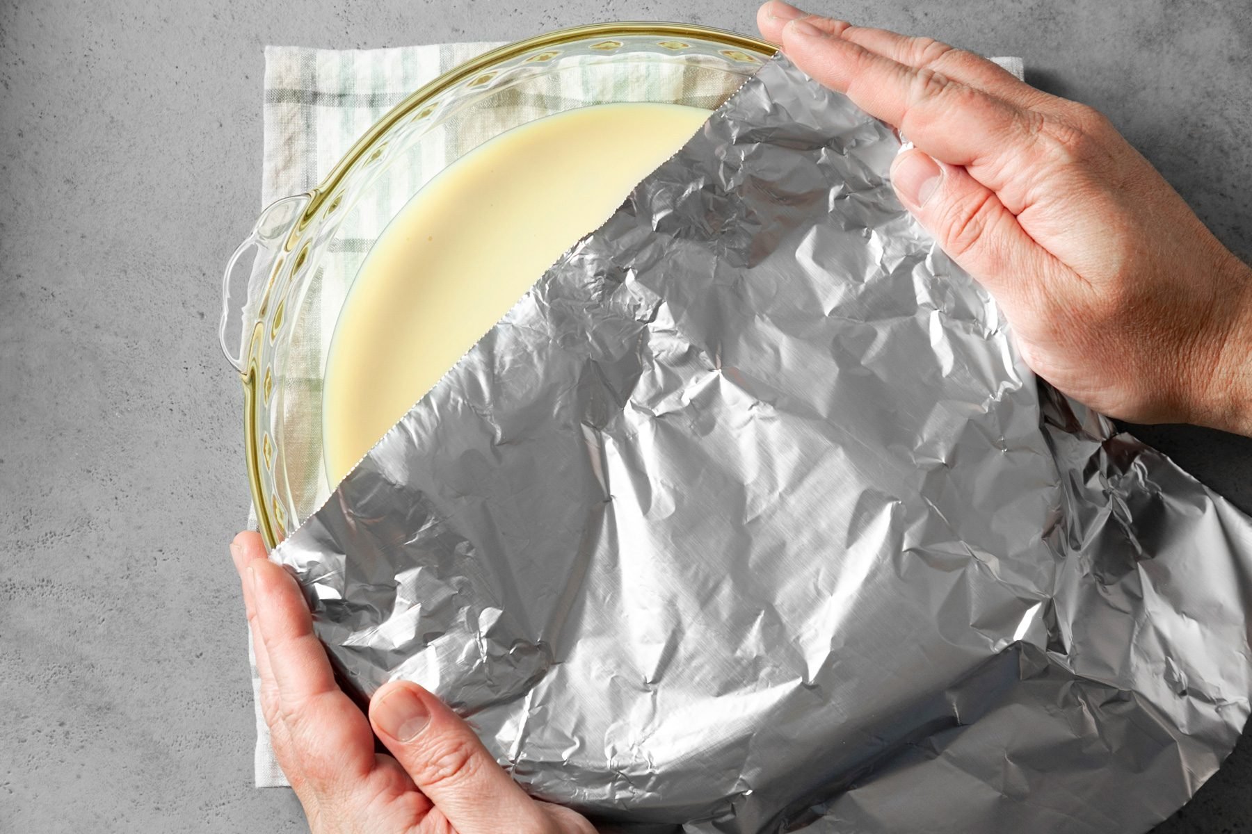 Cover the pie plate with aluminum foil.