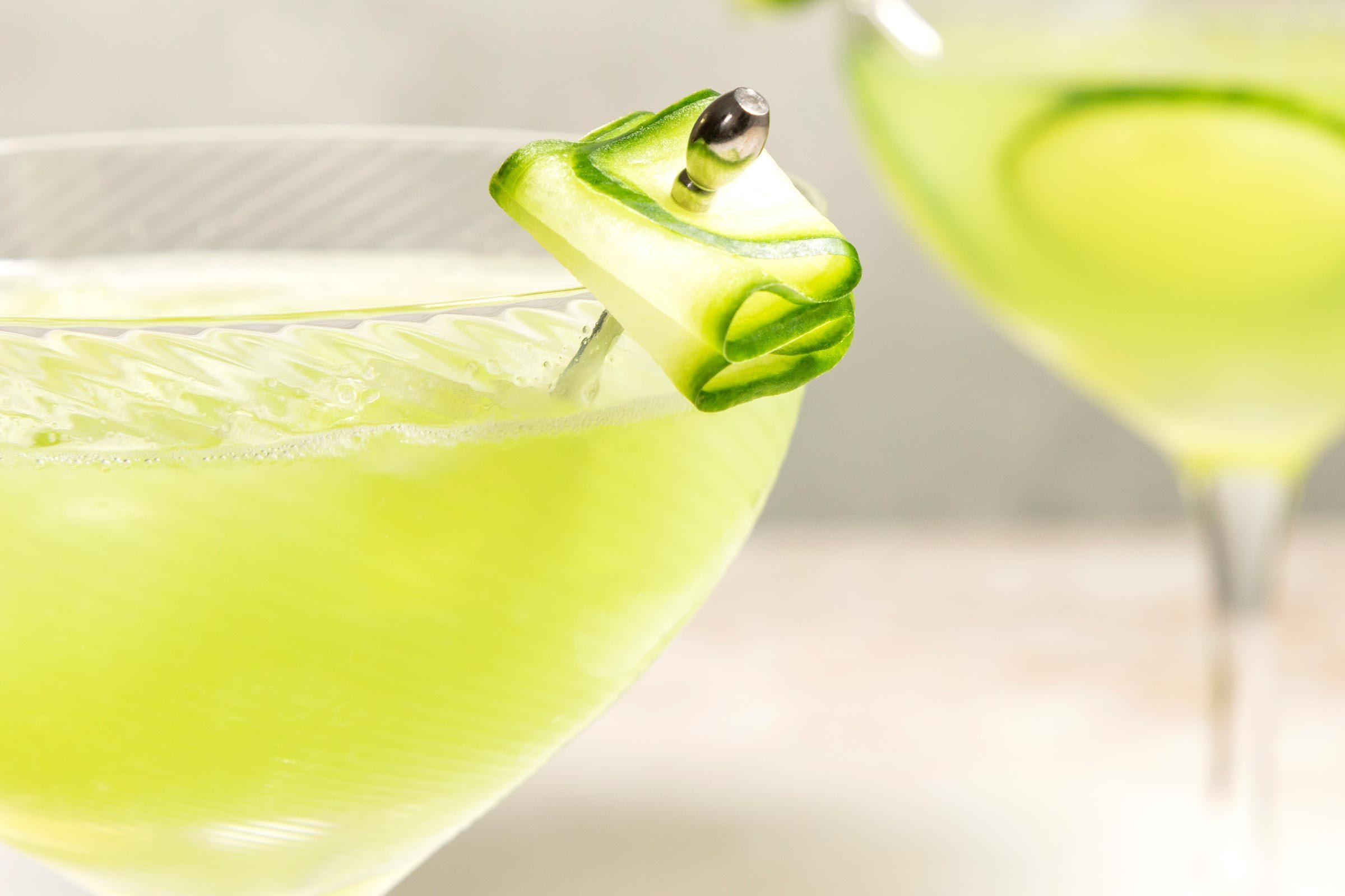 close up of cucumber garnish on a cucumber margarita glass