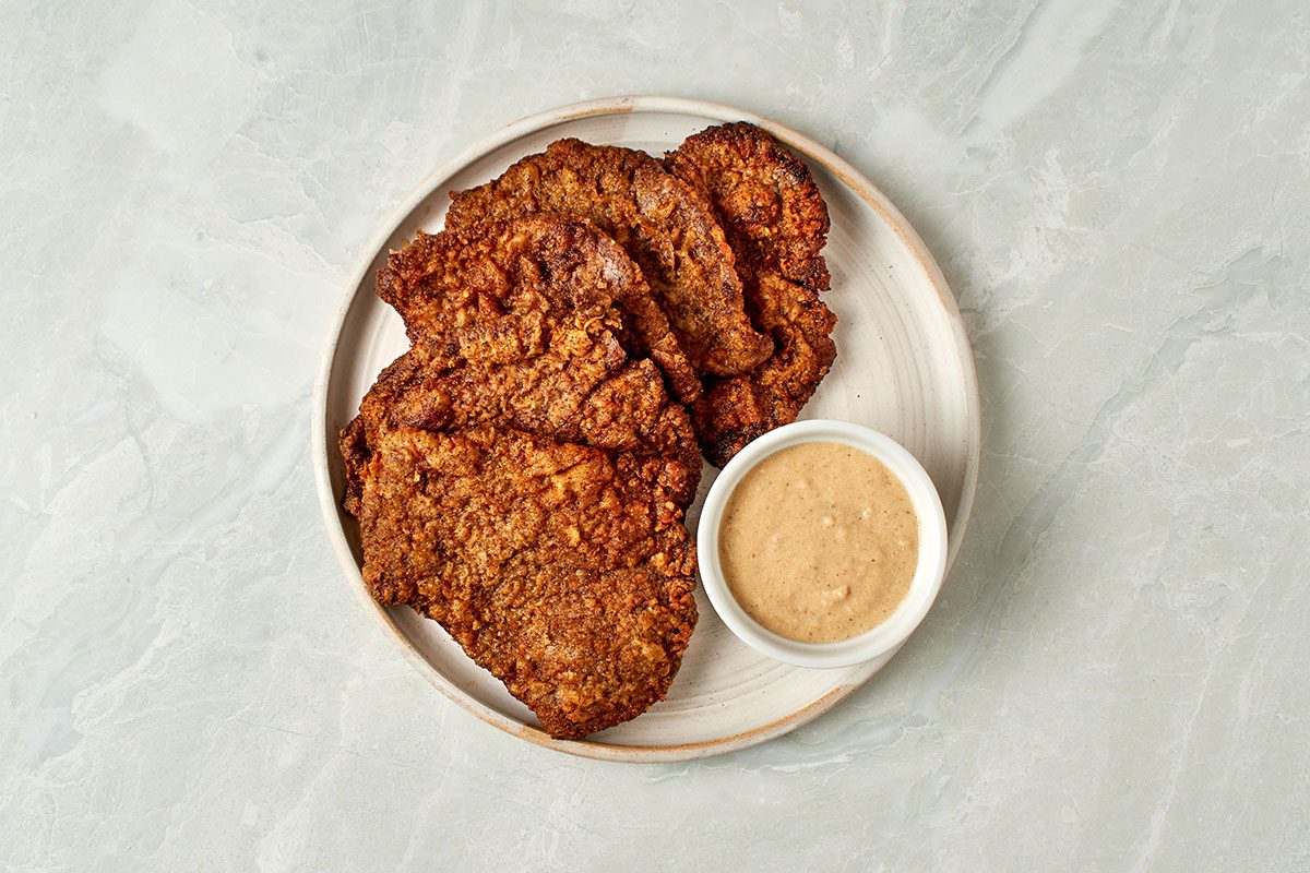 This crispy fried cube steak recipe by Taste of Home marries buttermilk and evaporated milk into its batter to yield and extra-flavorful and tender cutlet.
