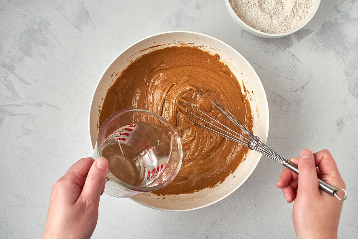 Whisk dry ingredients alternating with water