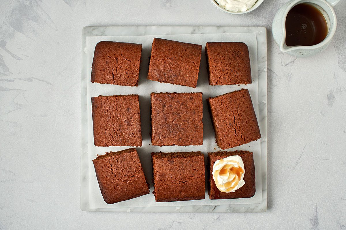 Slice cake and top with caramel sauce and whipped cream