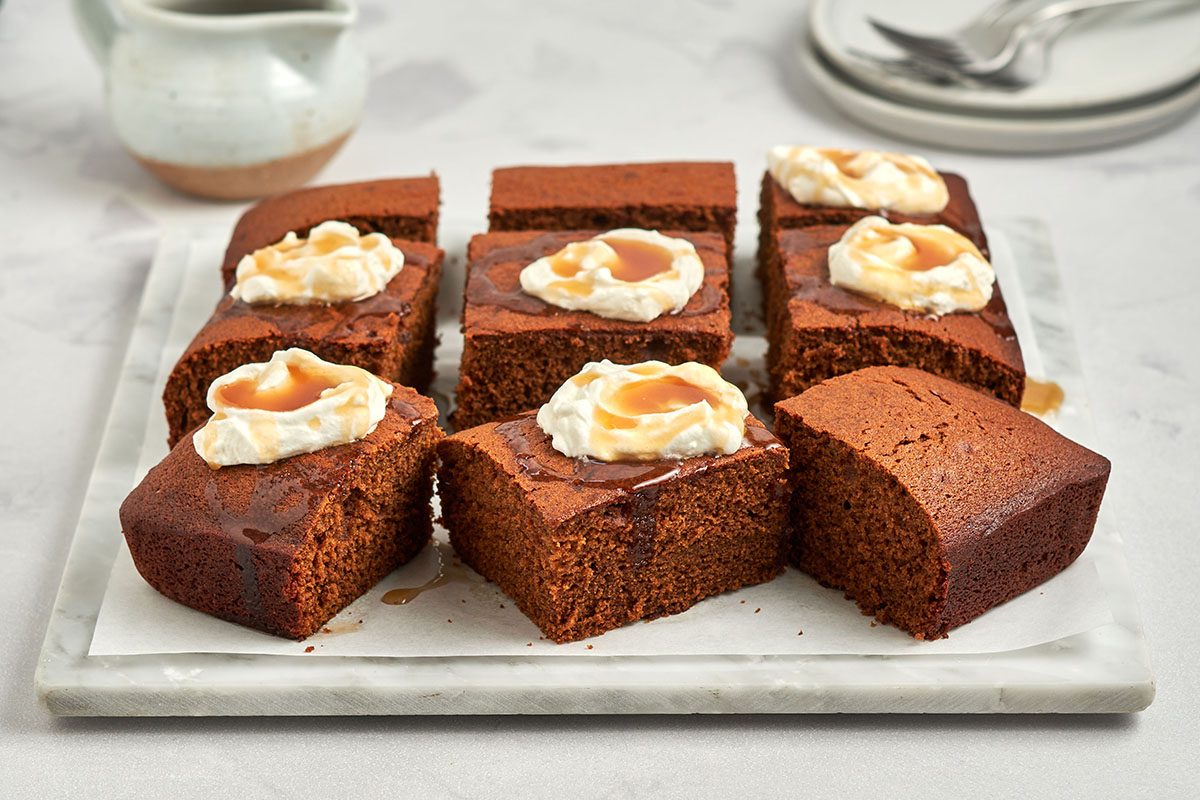 Slice cake and top with caramel sauce and whipped cream