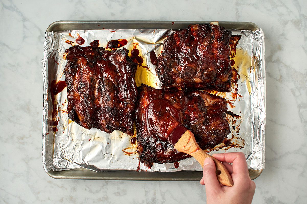 Brush ribs with barbecue sauce