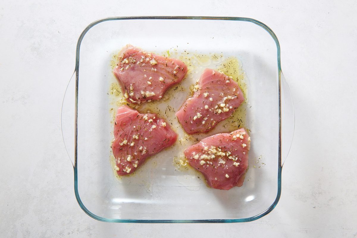 Marinating the tuna steaks