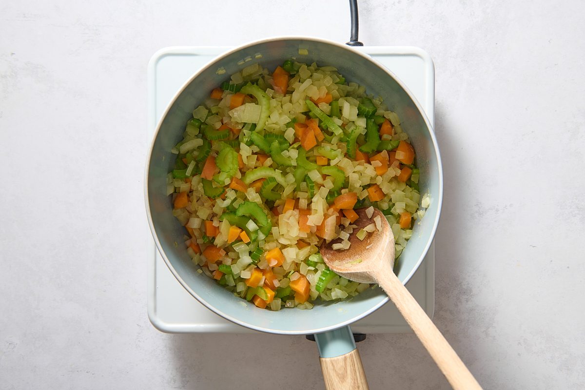 Sautéing vegetables in a saucepan