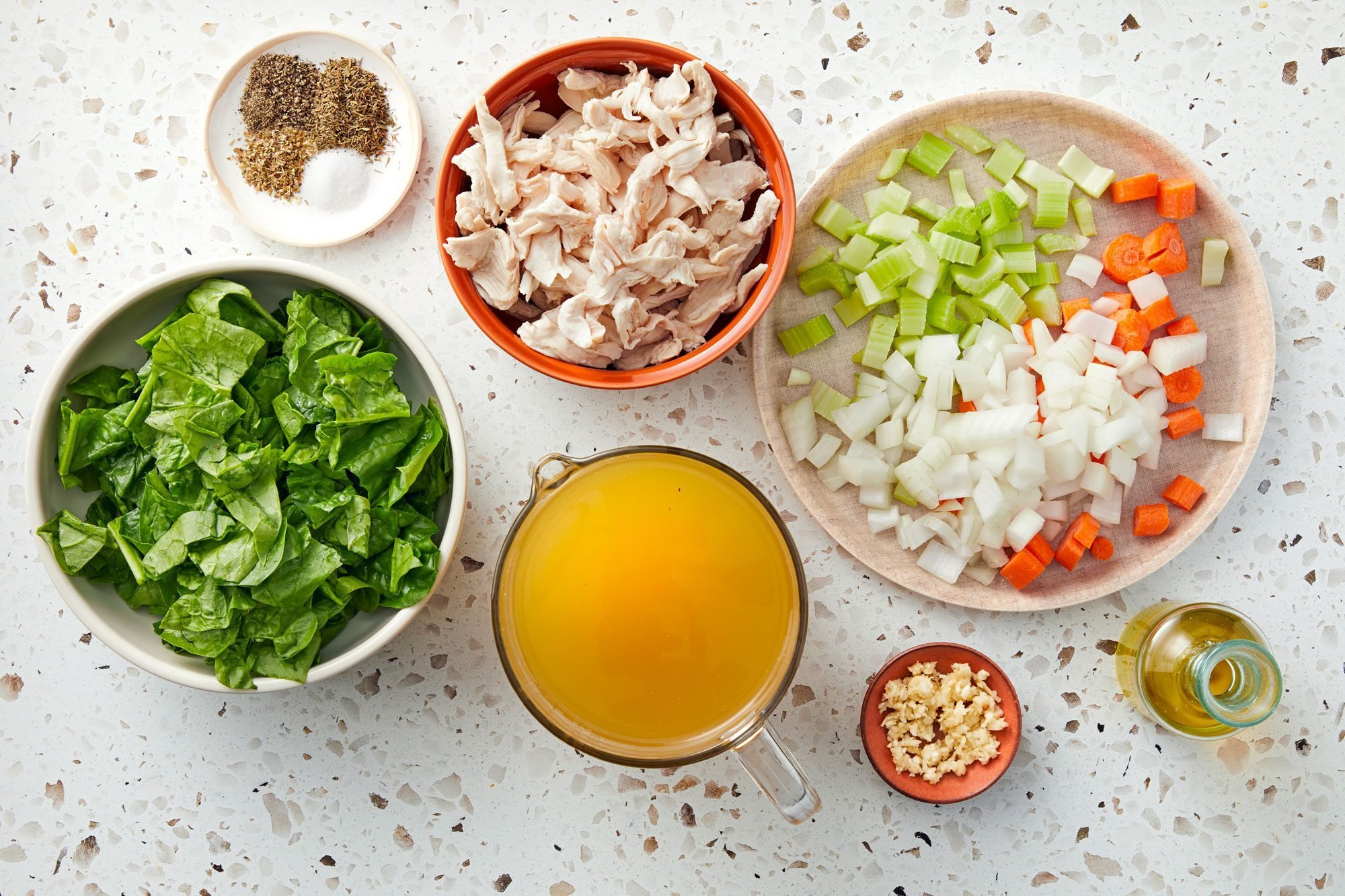 overhead shot of ingredients for Keto Chicken Soup; white background;