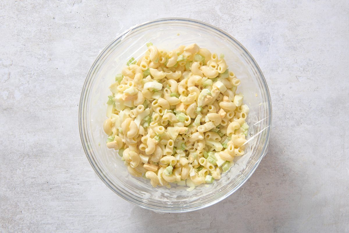 Covering the macaroni egg salad ready for the fridge