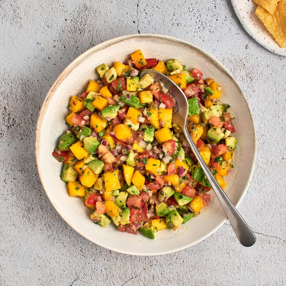 This mango avocado salsa recipe by Taste of Home takes your favorite chip dip and elevates it, thanks to the addition of sweet, tropical mango.