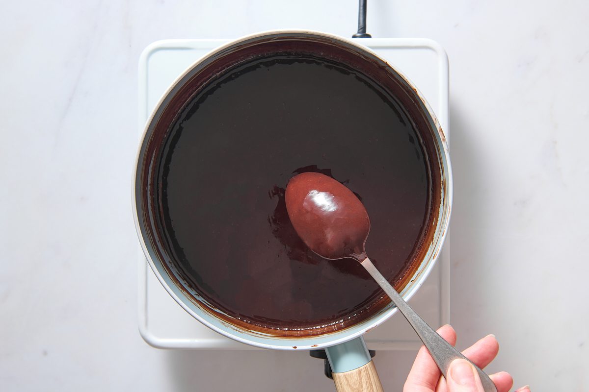 The custard thickened and coating the back of a spoon