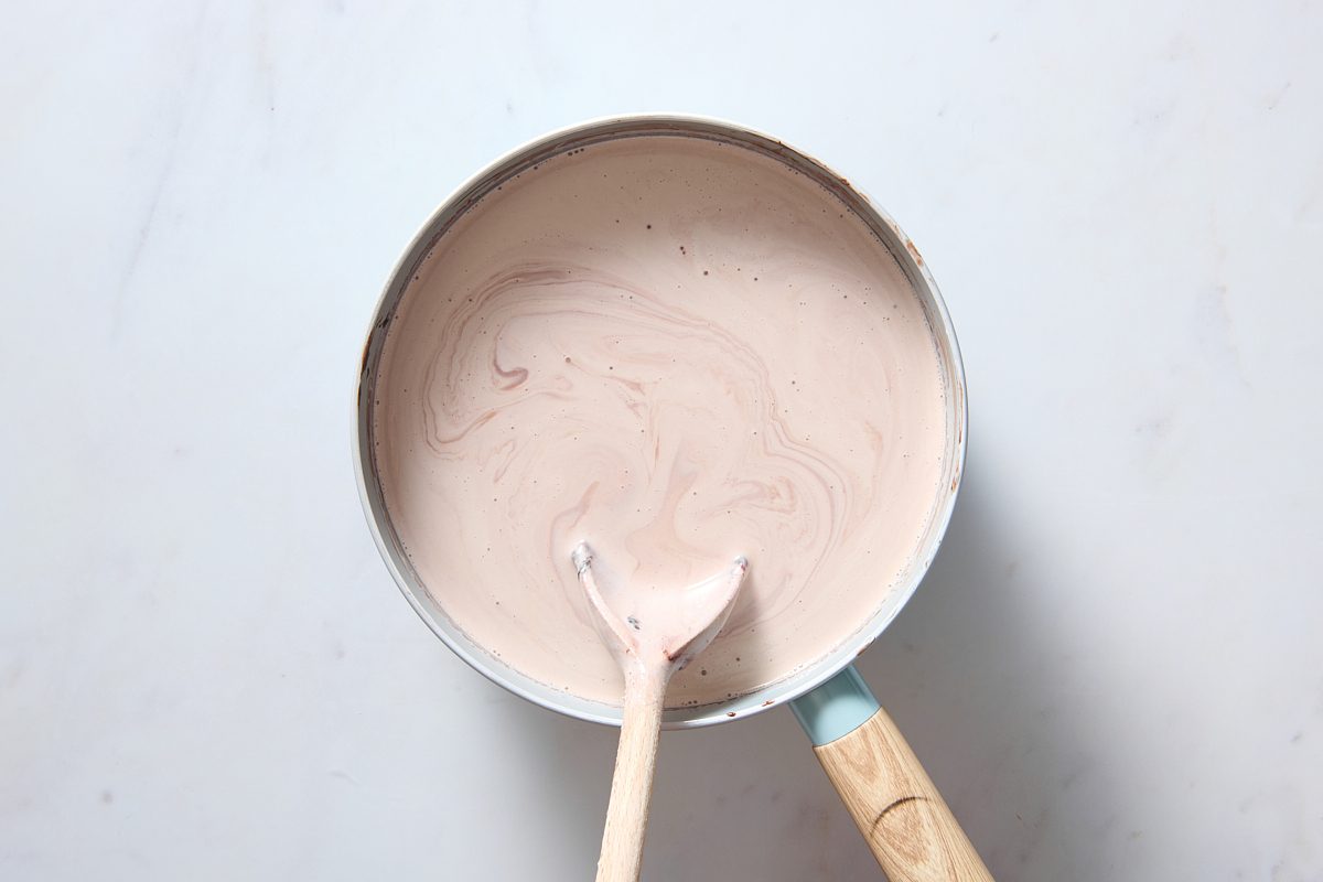 Stirring the remaining ingredients into a saucepan