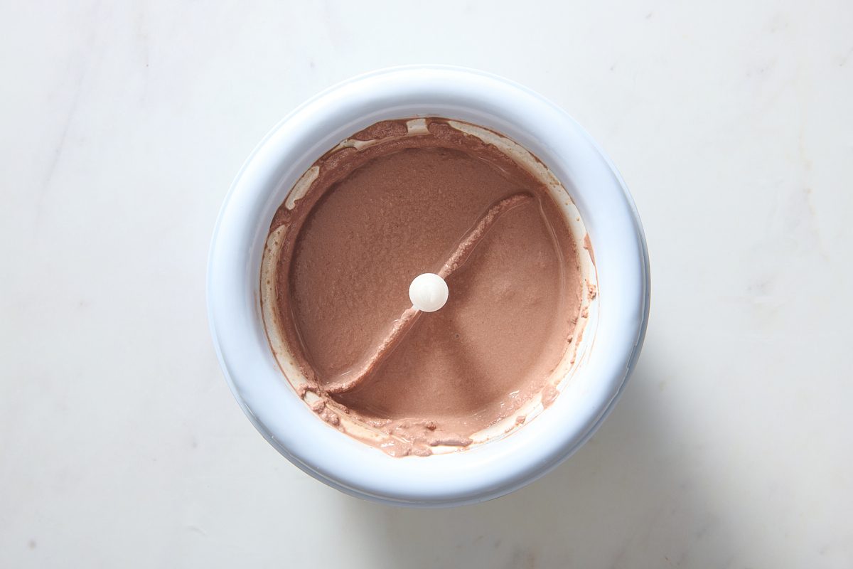 Mocha ice cream being churned in an ice cream maker