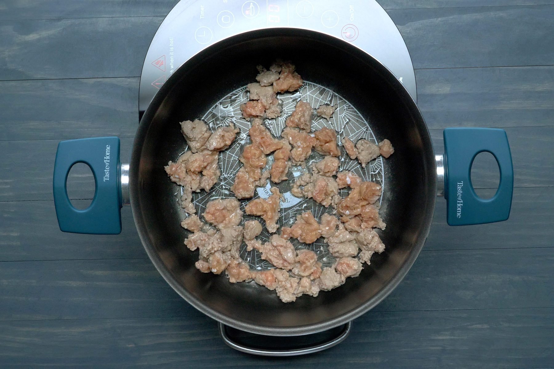 Sausage cooking in a large saucepan