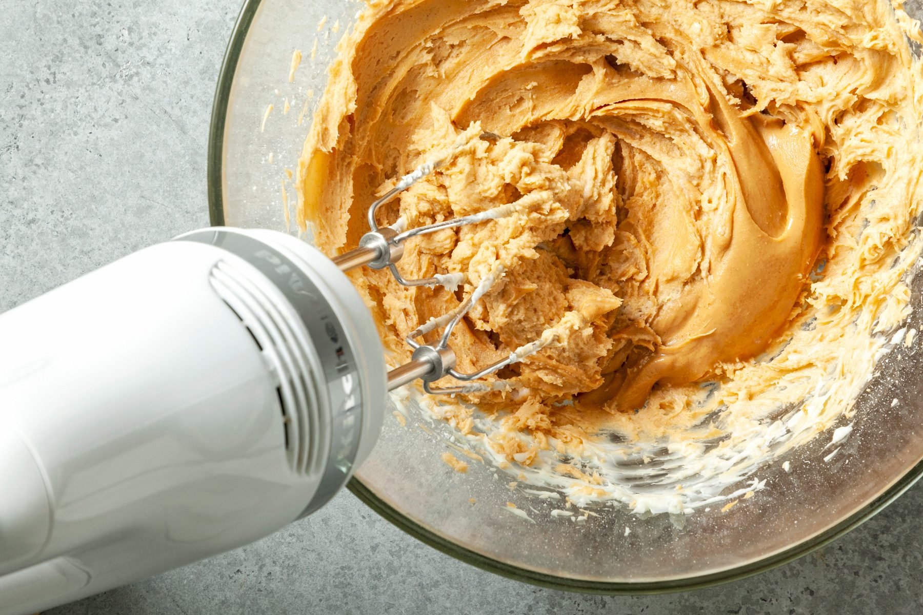 Gradually beat in the peanut butter until smooth