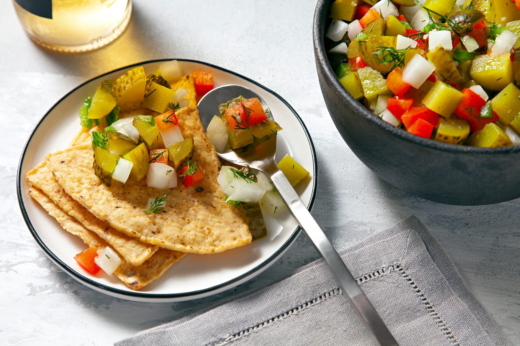 Pickle De Gallo served with chips in a plate