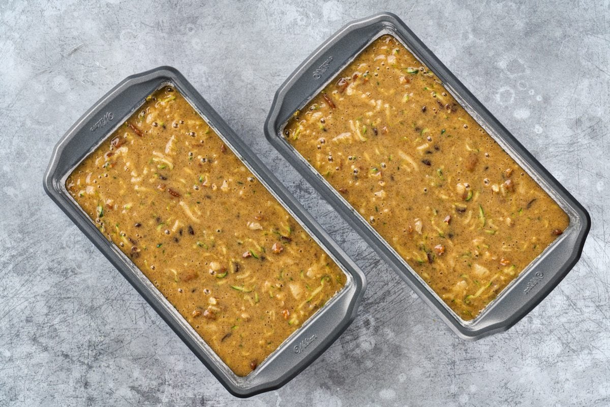 two baking pans of Pineapple Zucchini Bread ready to go into the oven