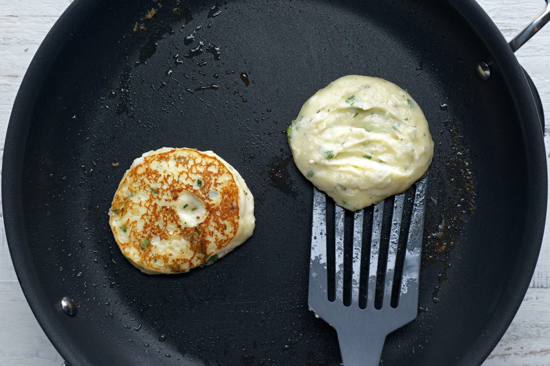 Cooking the pancakes on each side by flipping it on the skillet