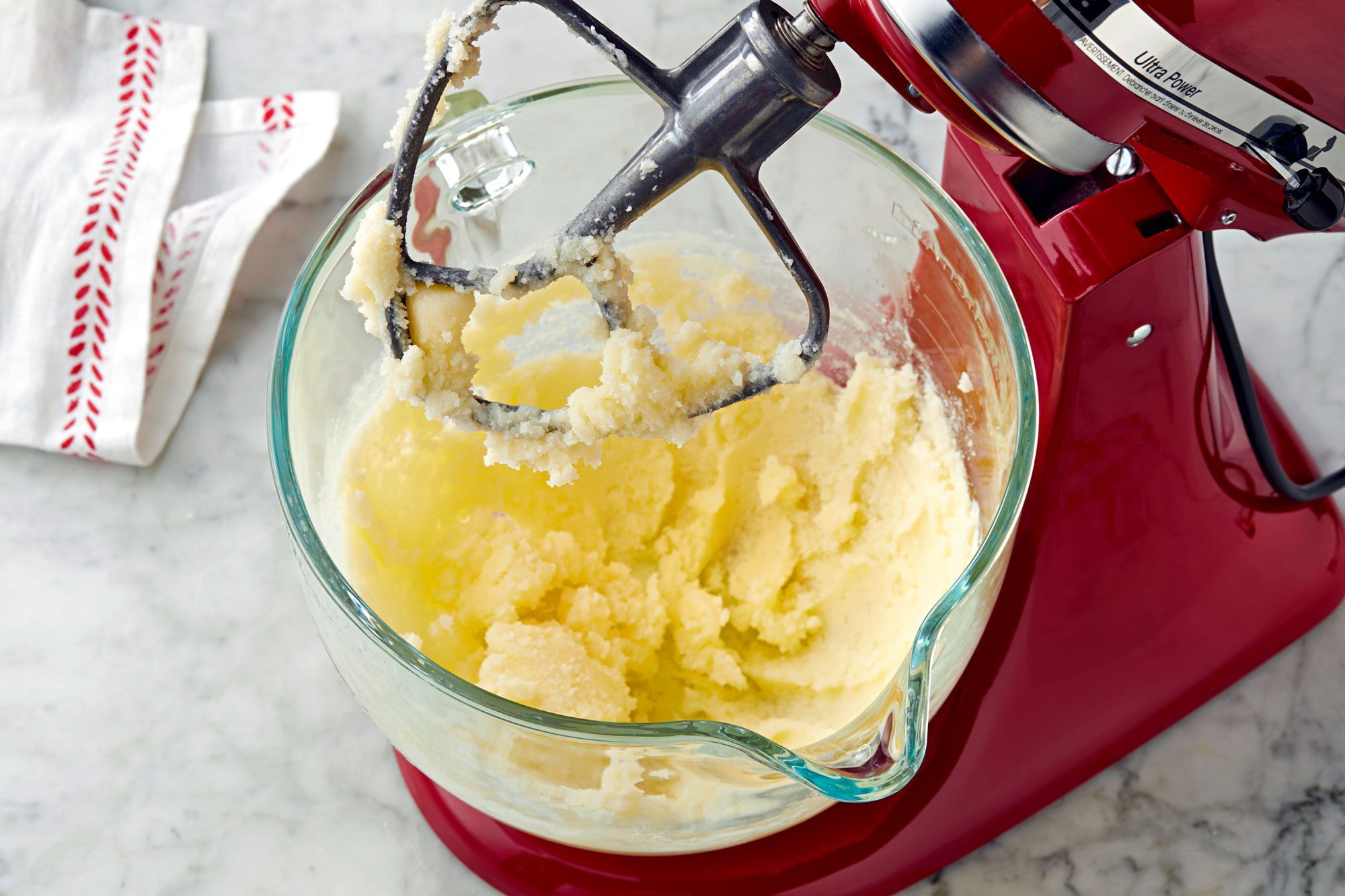 In a large bowl, mix cream butter and sugar until light.