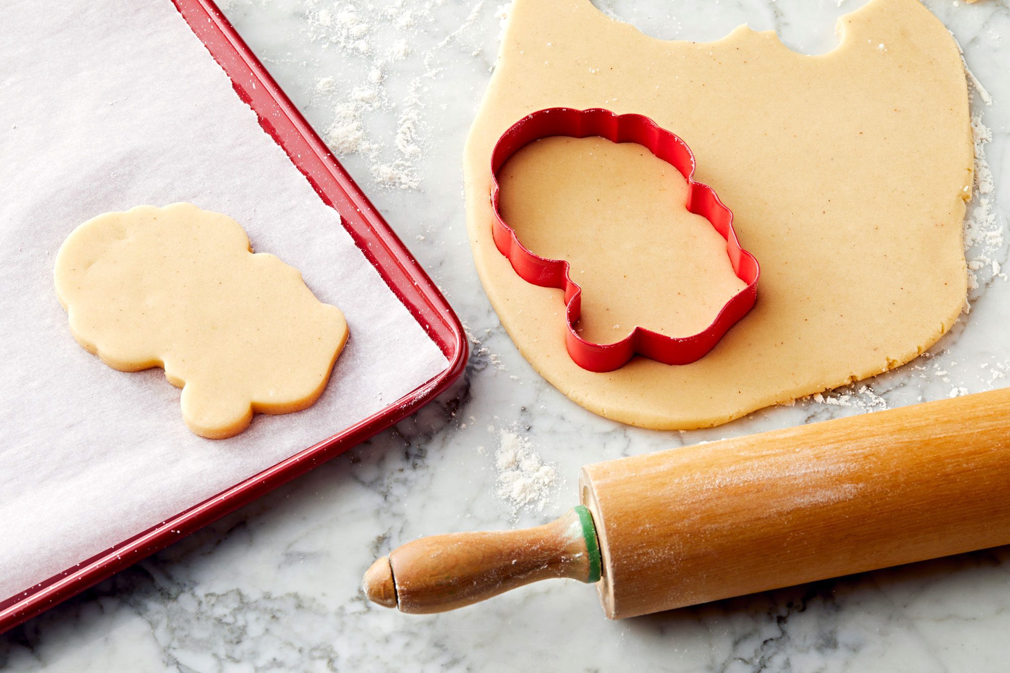 Roll each portion of dough to 1/4-in. thickness. Cut with a floured 3-in. with Santa-shaped cookie cutter.