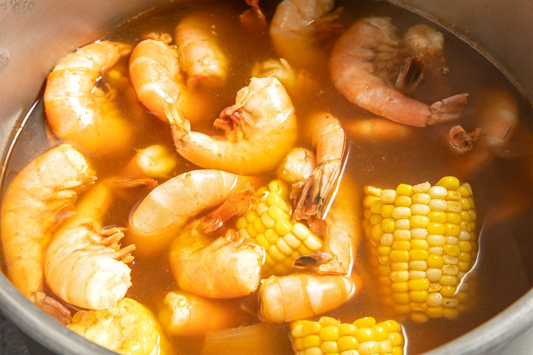 close shot of boiled shrimps with sweet corn