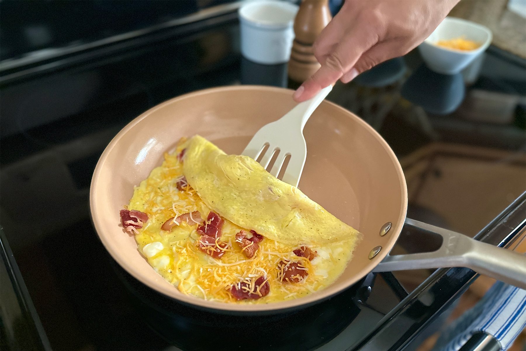 Flipping omelet on pan