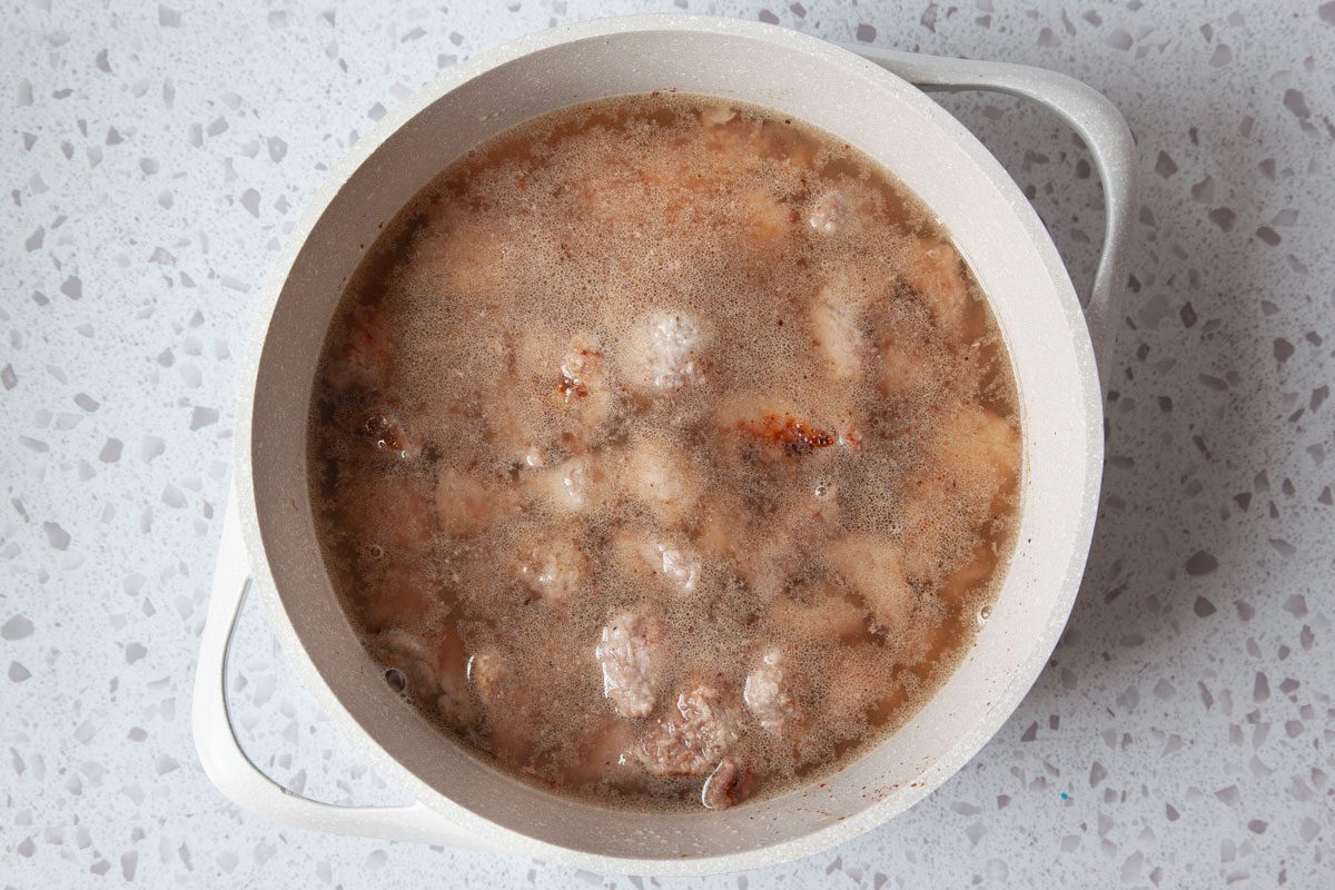 Step 2 of Taste of Home Beef Stew with Dumplings is to add the water to the beef and simmer for 1.5 hours