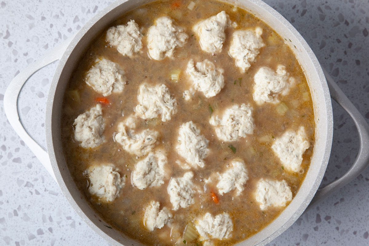 Step 5 of Taste of Home Beef Stew with Dumplings is to drop the dumplings by tablespoonfuls into the stew and cover, simmering the stew and steaming the dumplings