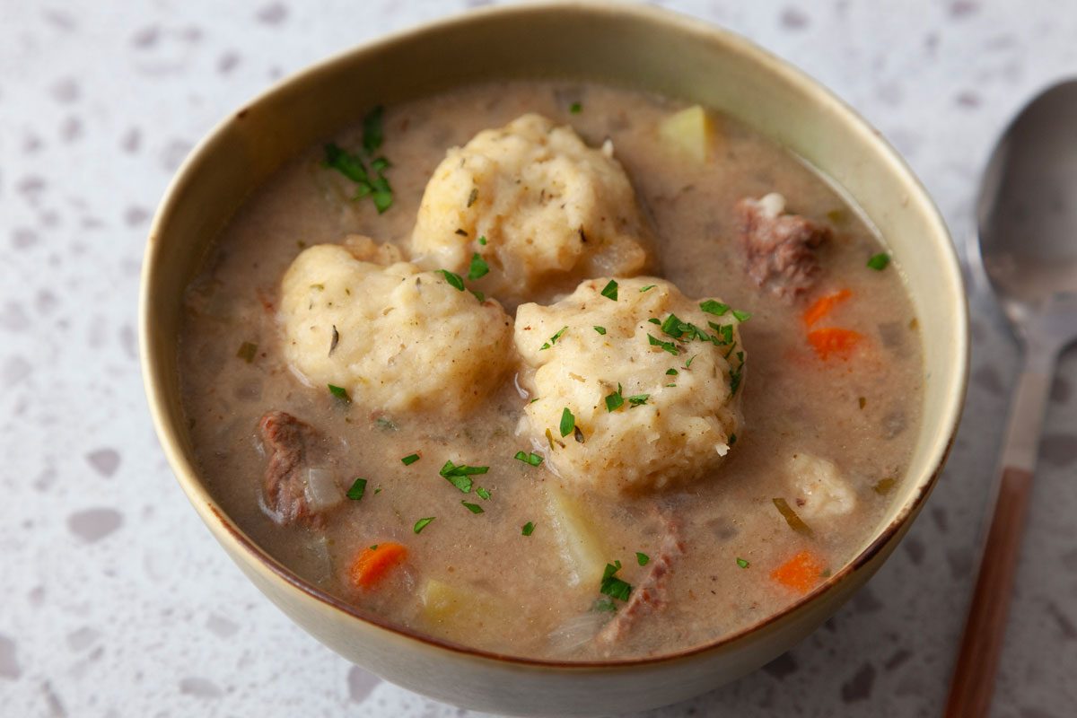 Single serving of Taste of Home Beef Stew with Dumplings in a green bowl