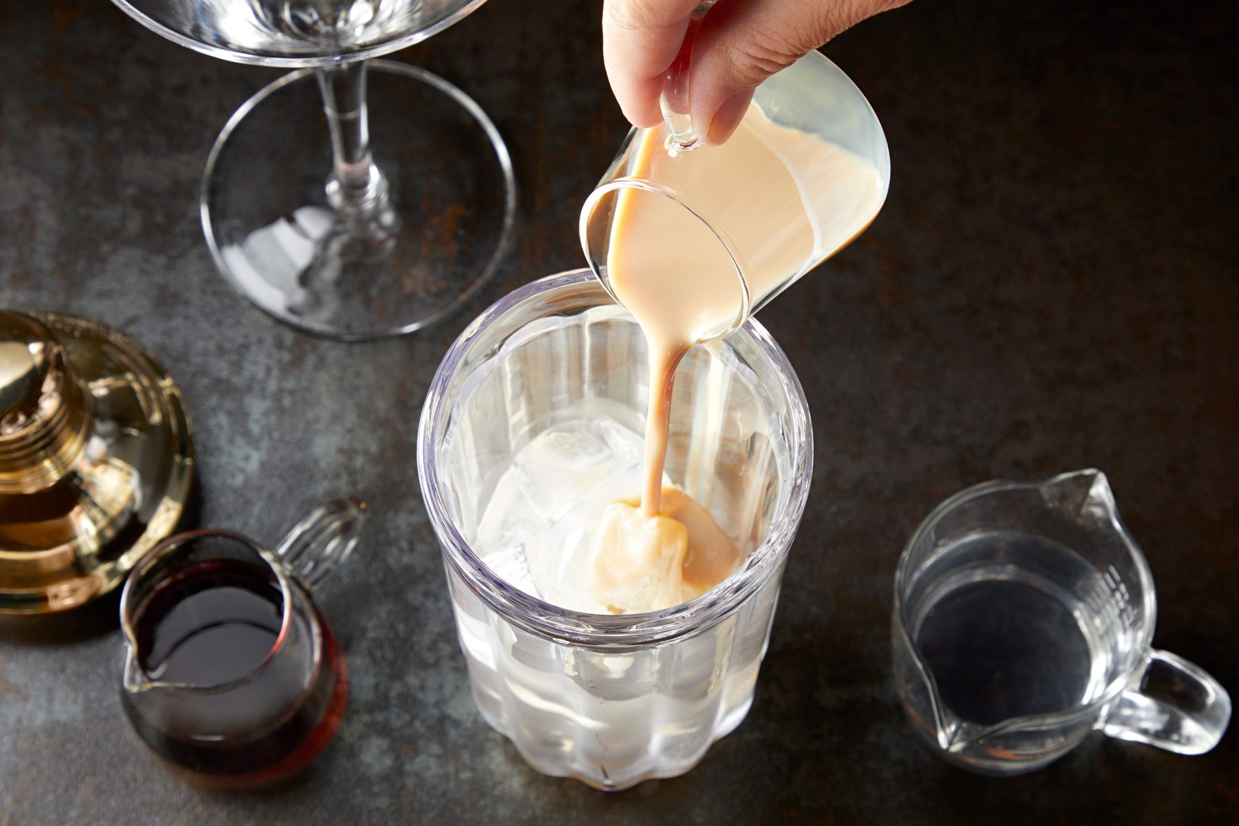 Irish cream liqueur, chocolate liqueur and vodka in a shaker