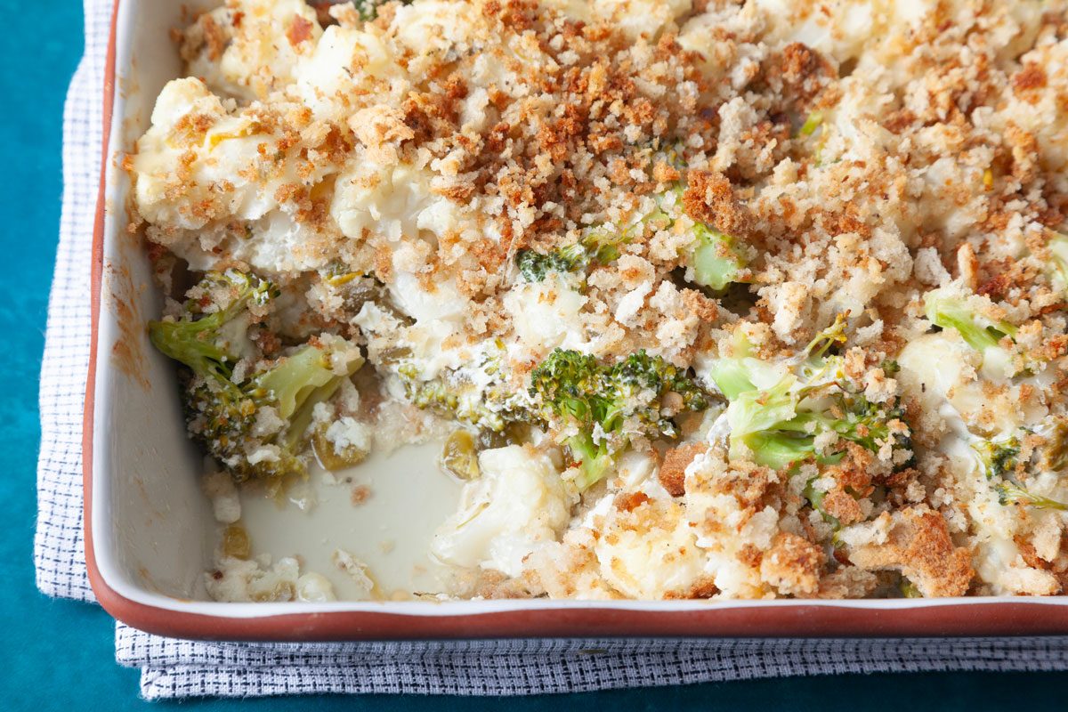 Close up of full yield of Taste of Home Broccoli Cauliflower Bake with a scoop out